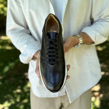 swatche, Sneakers en cuir noir pour homme.